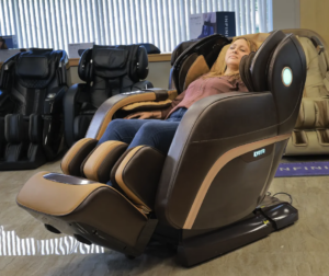 Picture of a Massage Chair Store Review Team member reclining in a bronze Kyota M989 Yutaka massage chair.